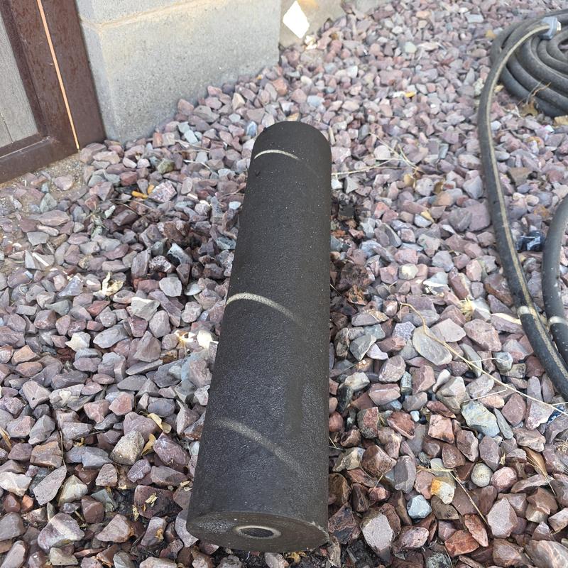 Sediment filter cartridge removed on gravel surface