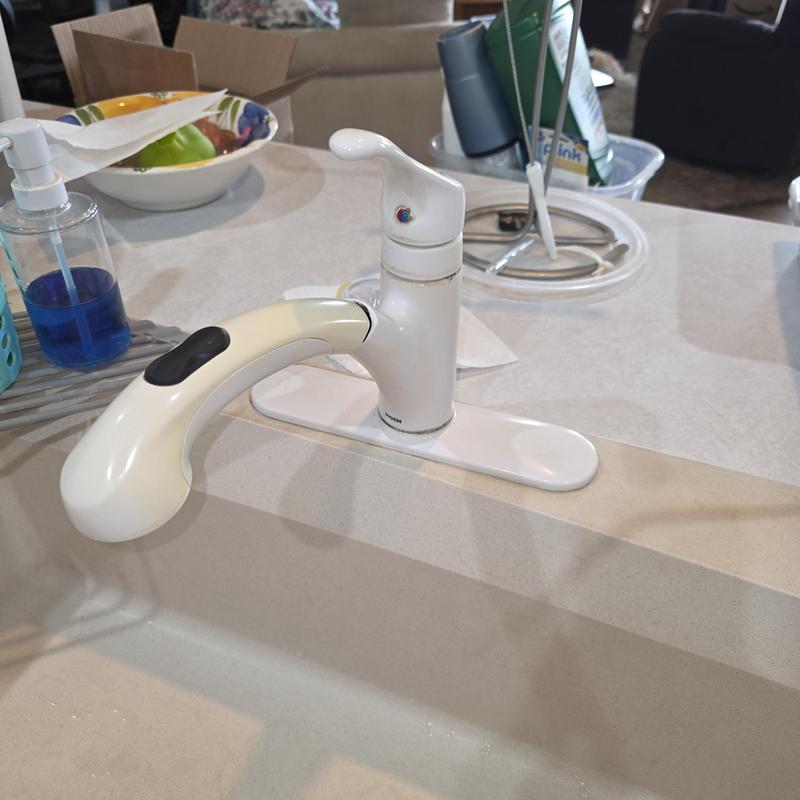 Kitchen faucet with pull-out spray handle installed