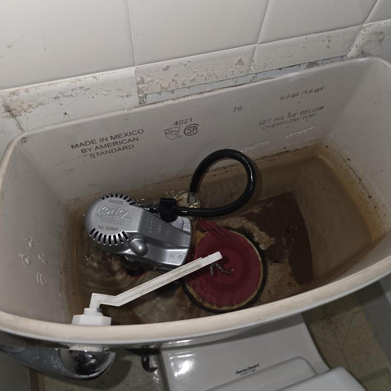 Toilet fill valve and flapper installation inside tank
