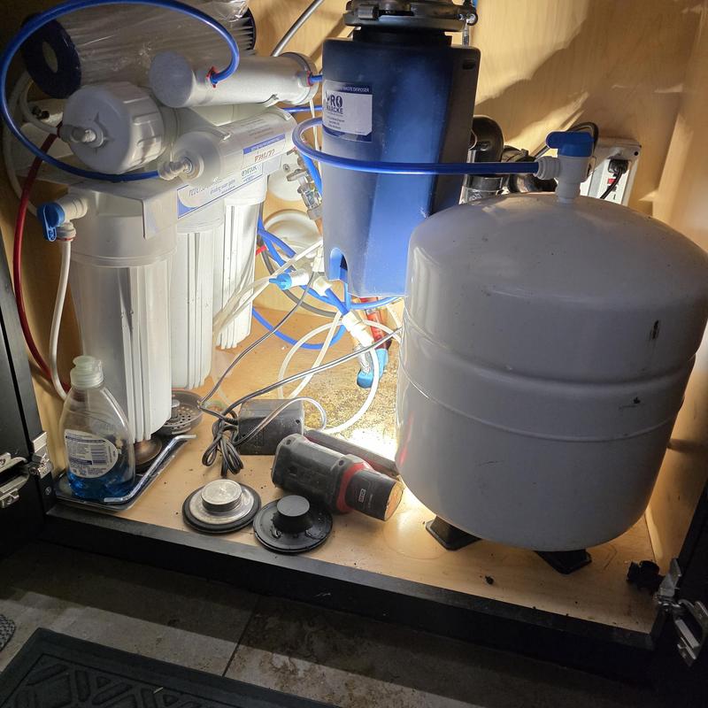 Reverse osmosis water filter system installation under sink