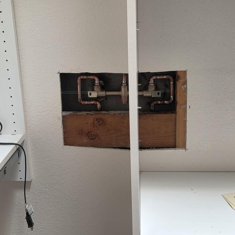 Shower valve installation behind drywall cut