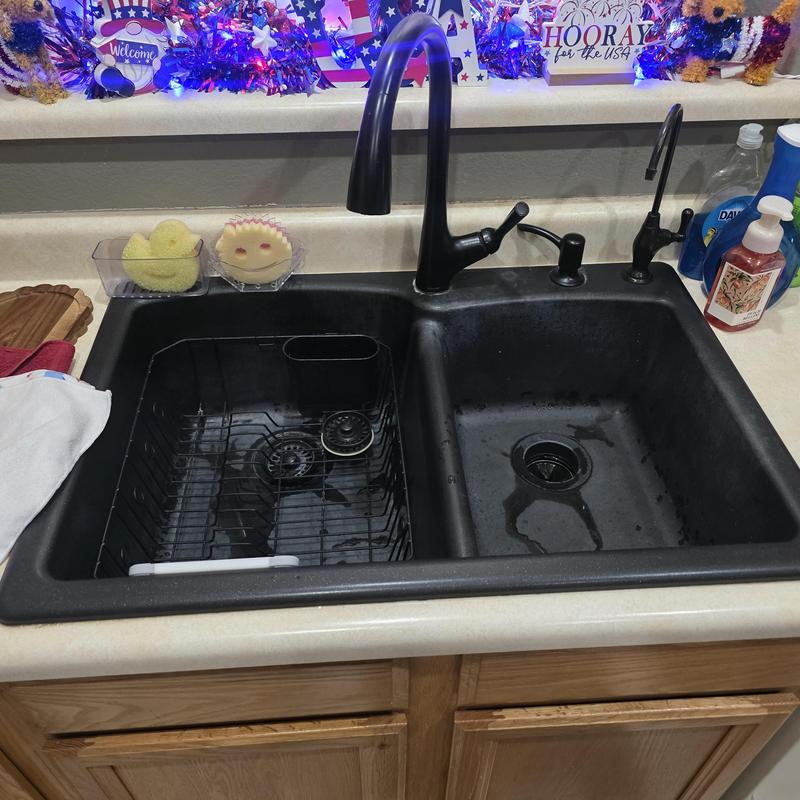 Kitchen sink drain with dual basin and black faucet
