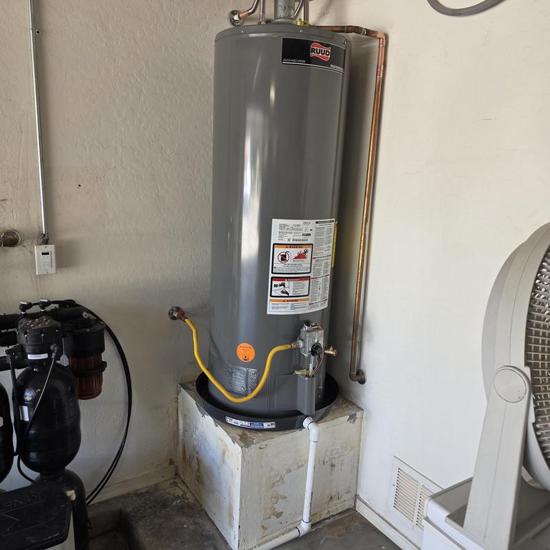 Natural gas water heater with drain pan and supply lines