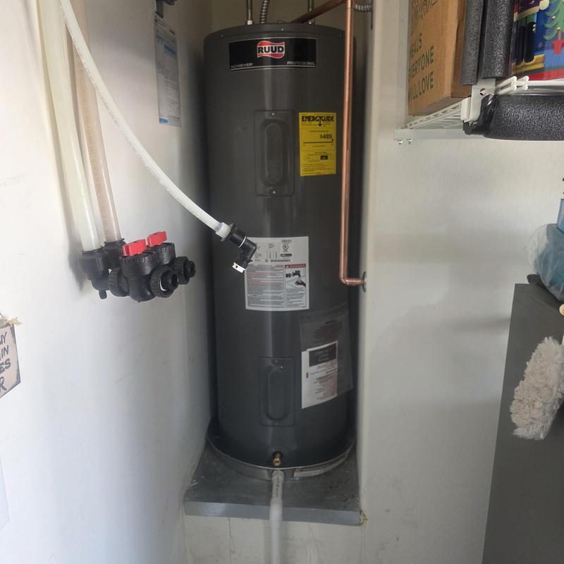 Electric water heater with copper piping installation