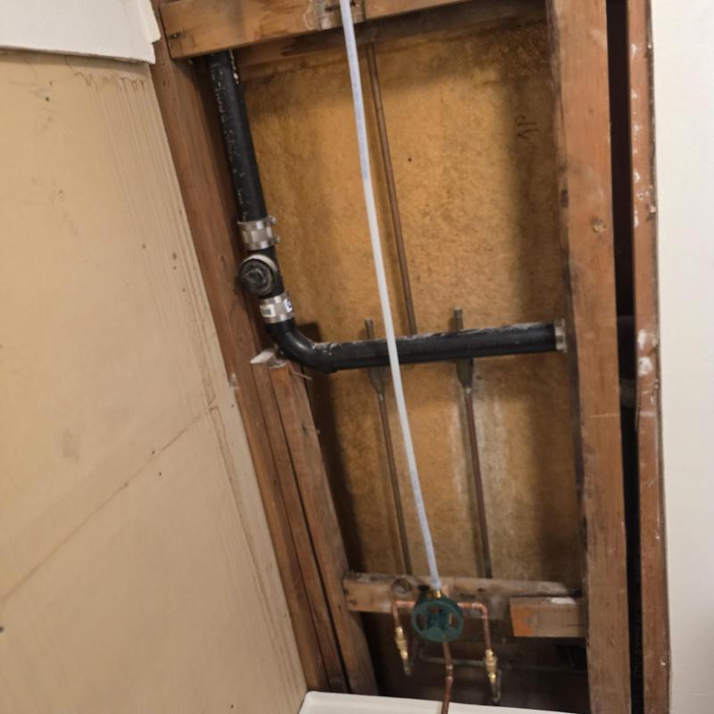 Tub valve installation with new drain pipes in wall cavity