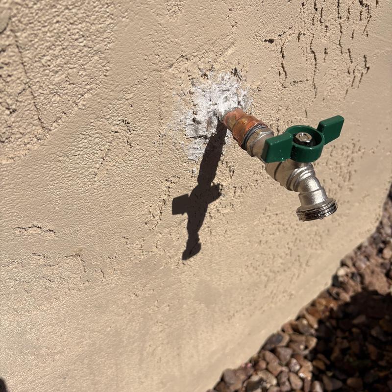Copper hose bibb soldered and sealed on exterior wall