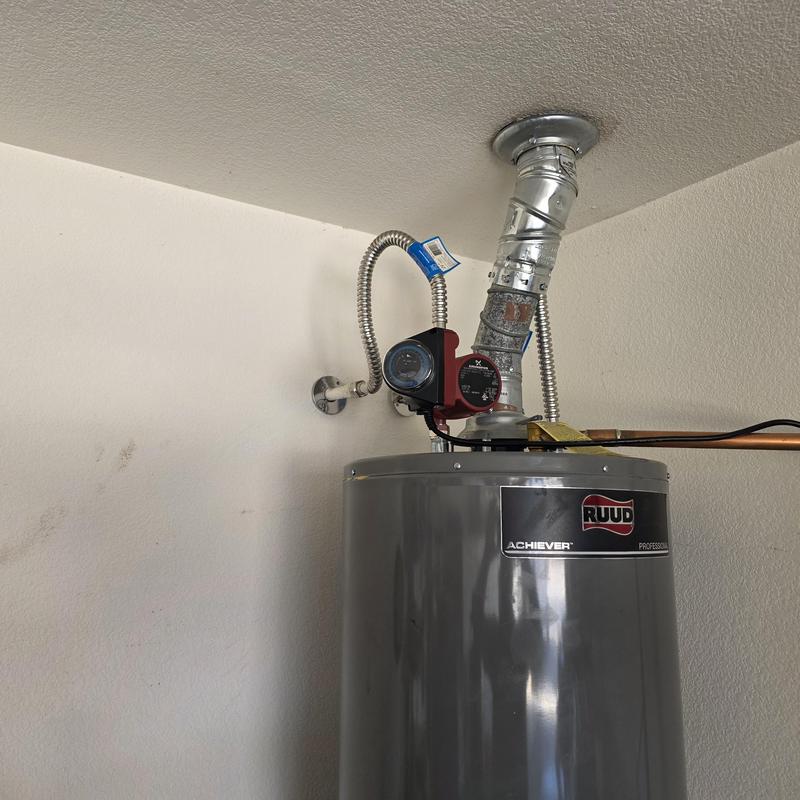 Hot water recirculation pump installed on water heater