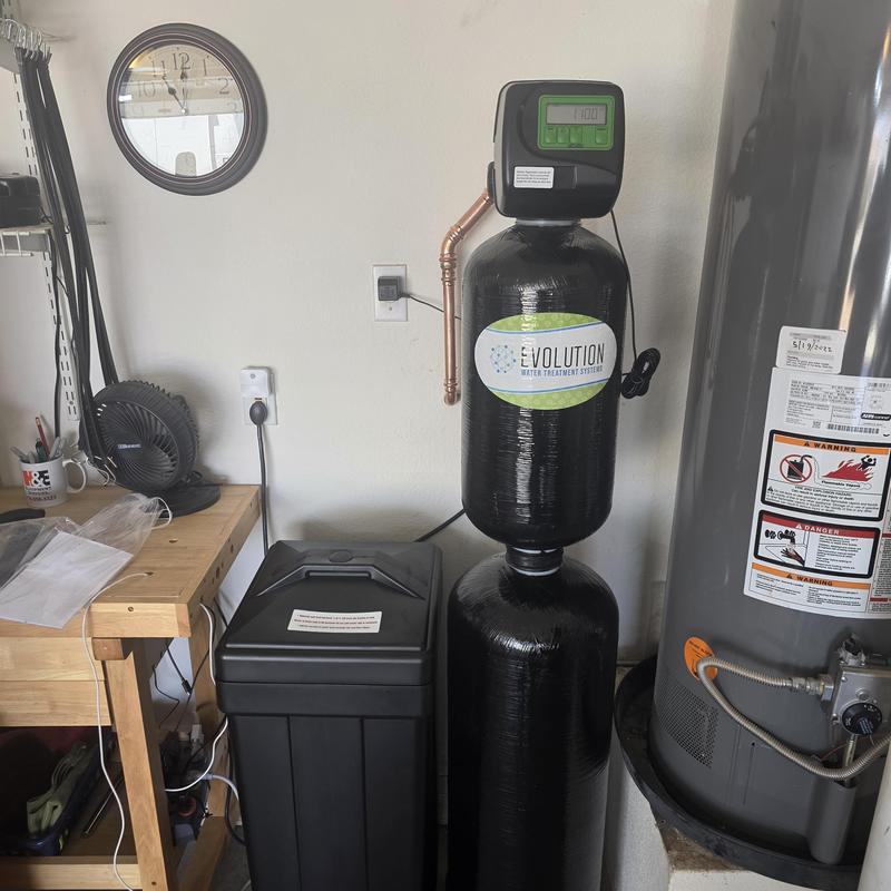 Water softener with filtration system installation in garage
