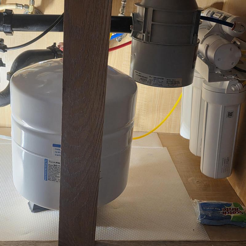 Reverse osmosis drinking water system installation in cabinet