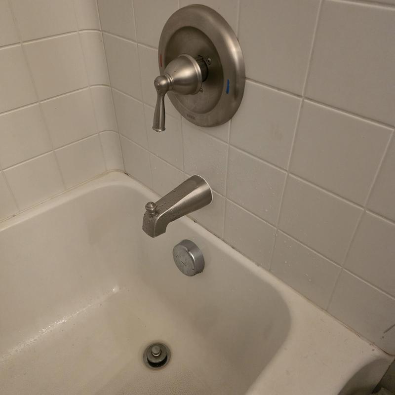 Tub spout and faucet handle installation in bathtub