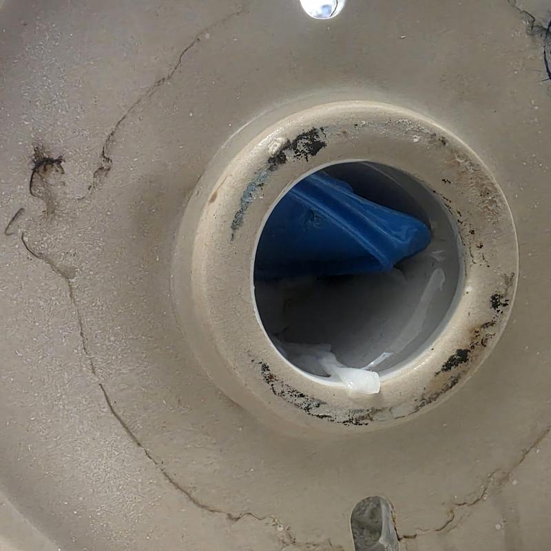 Toilet plastic lid removed from flange opening