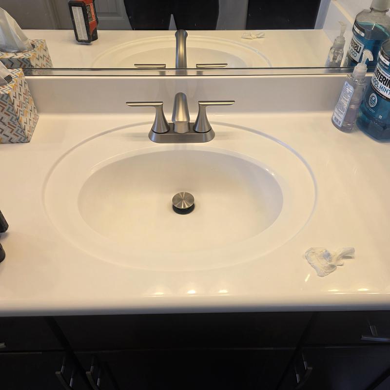 Four-inch lavatory faucet on white bathroom sink