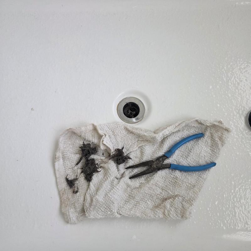 Freestanding tub drain clog cleared, hair removed