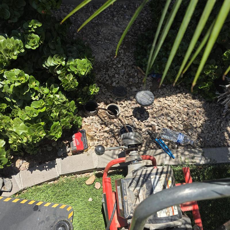 Sewer main yard clean-out with drain cleaning machine