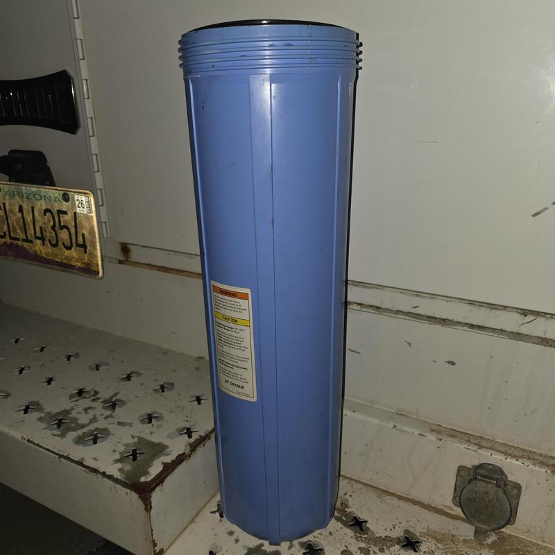 Water filter housing replacement part in truck bed