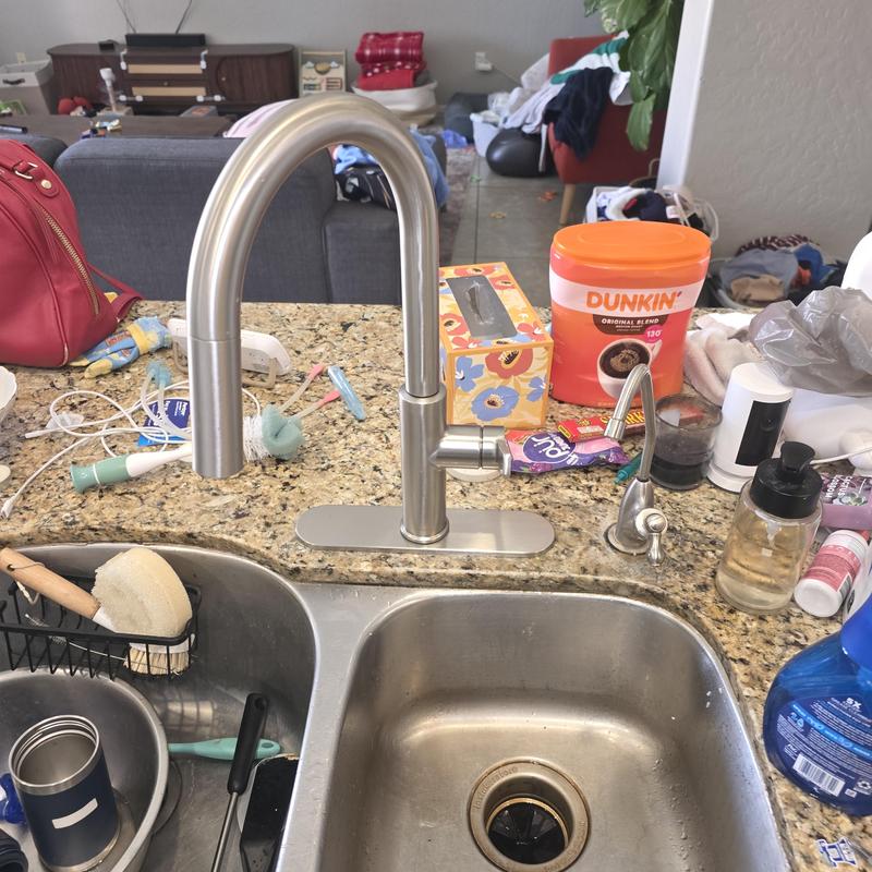 Kitchen faucet with soap dispenser by granite sink