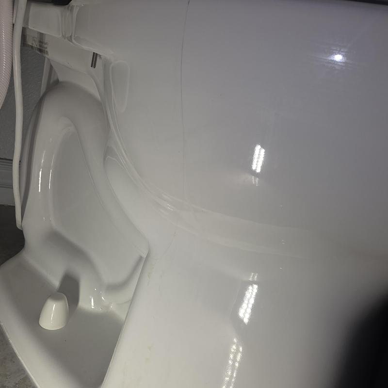 Toilet bowl with visible crack on side
