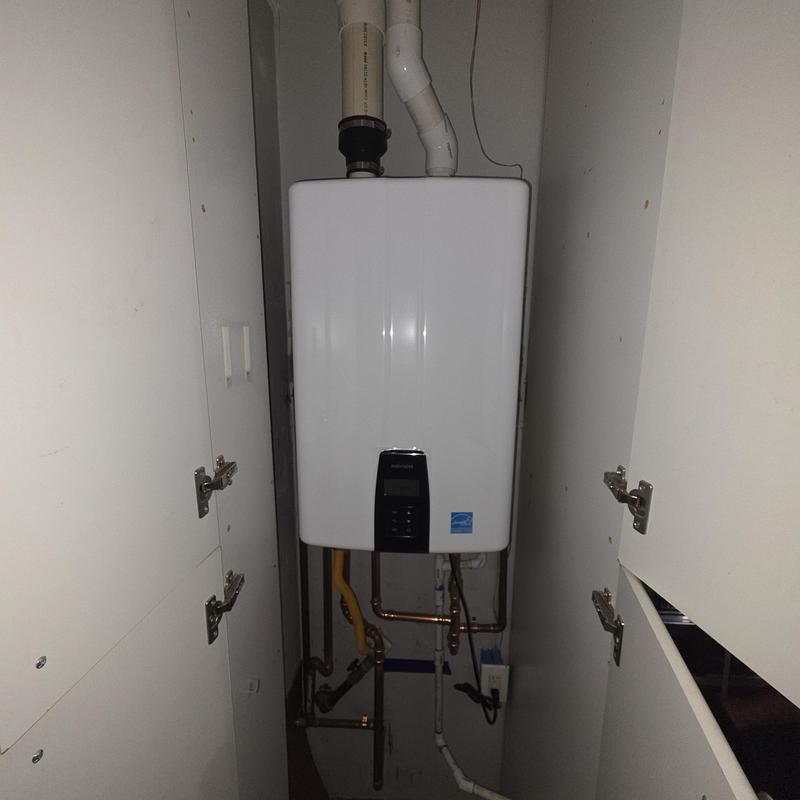 Tankless water heater installation with piping