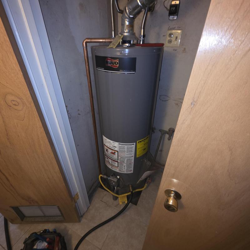 Water heater flushing setup in utility closet
