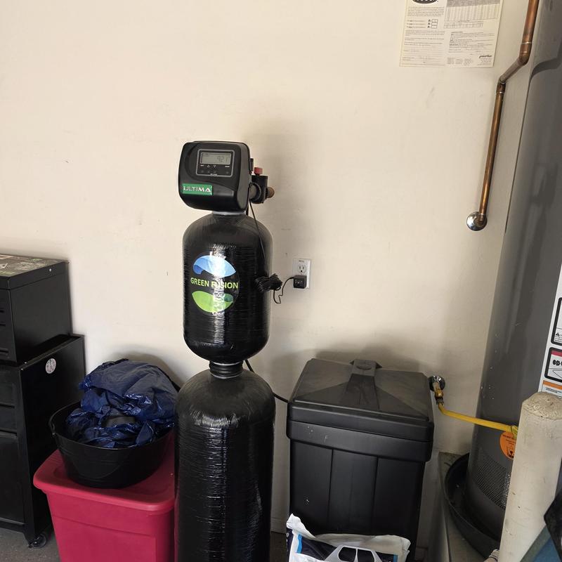 Water softener system with filtration unit installed